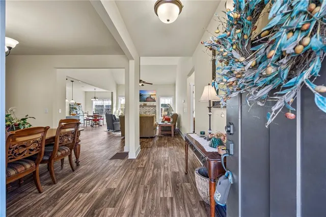 a very nice looking room with wooden floor and furniture