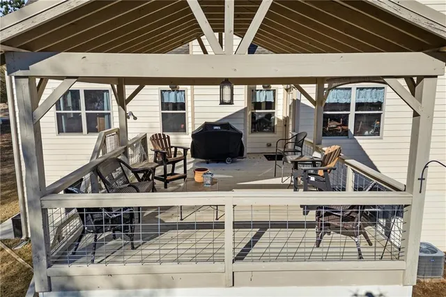 a roof deck with table and chairs