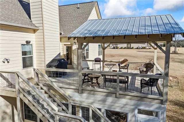 a view of sitting area with furniture and wooden deck