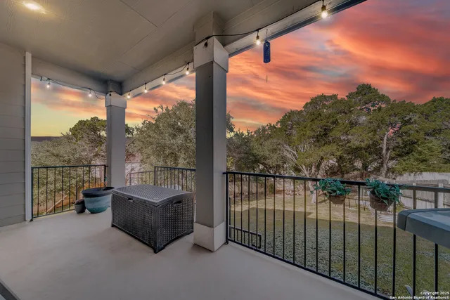 a balcony with furniture and city view
