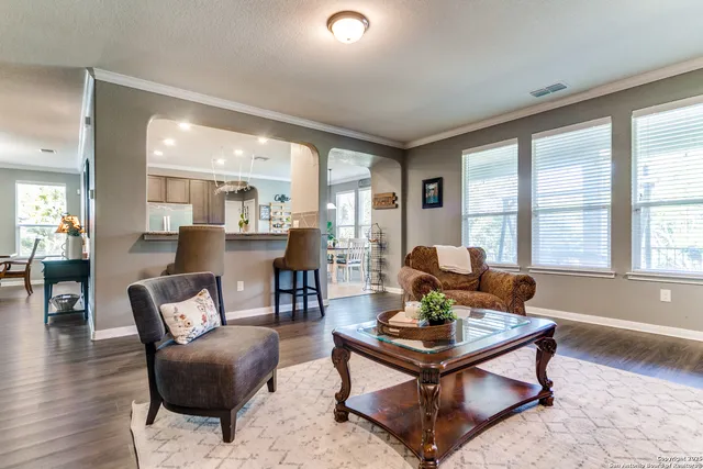 a living room with furniture and a large window