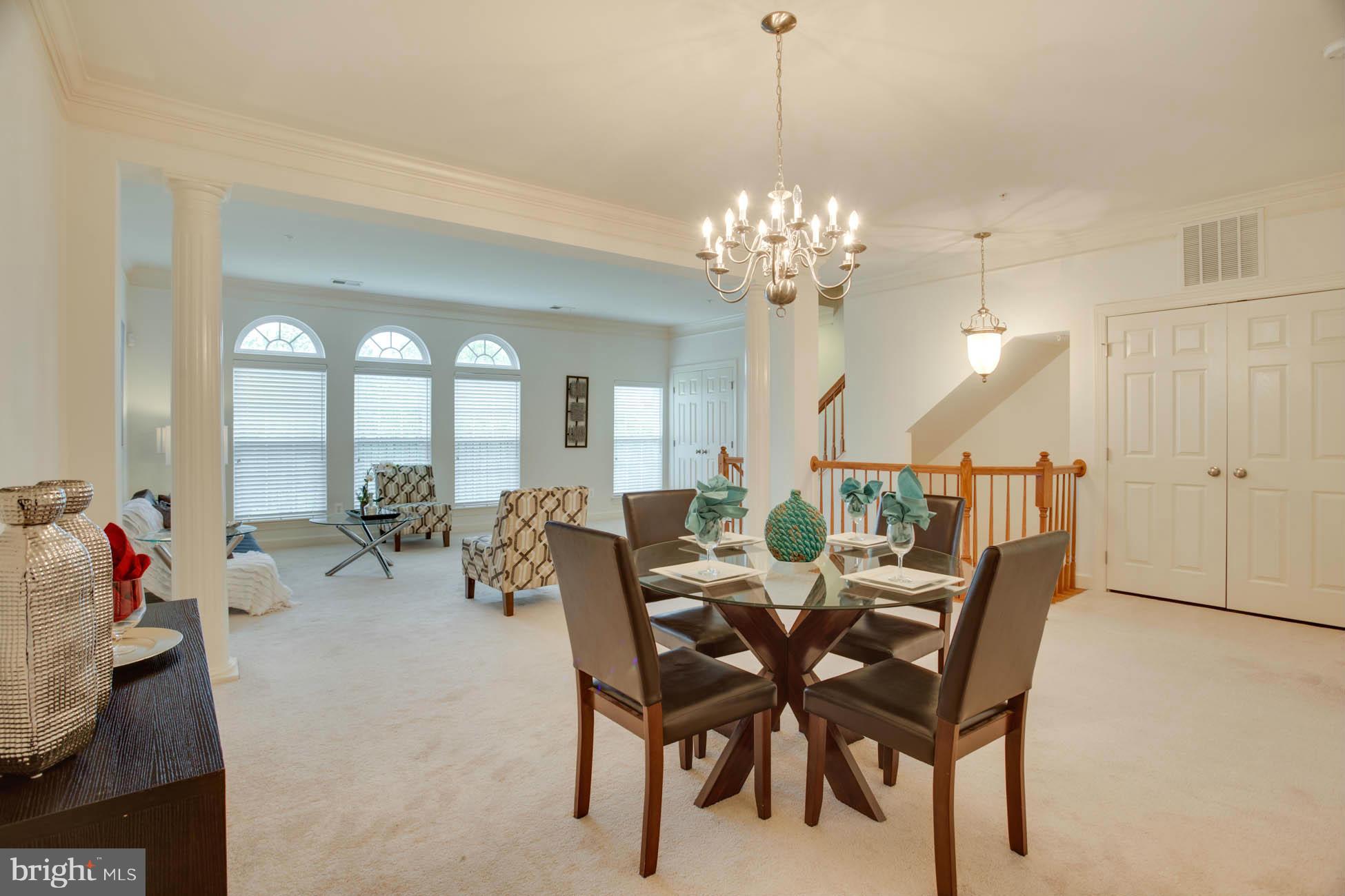 5723 Callcott Way, Unit M Alexandria, VA 22312 - Photo 1 of 28 a view of a dining room and livingroom with furniture