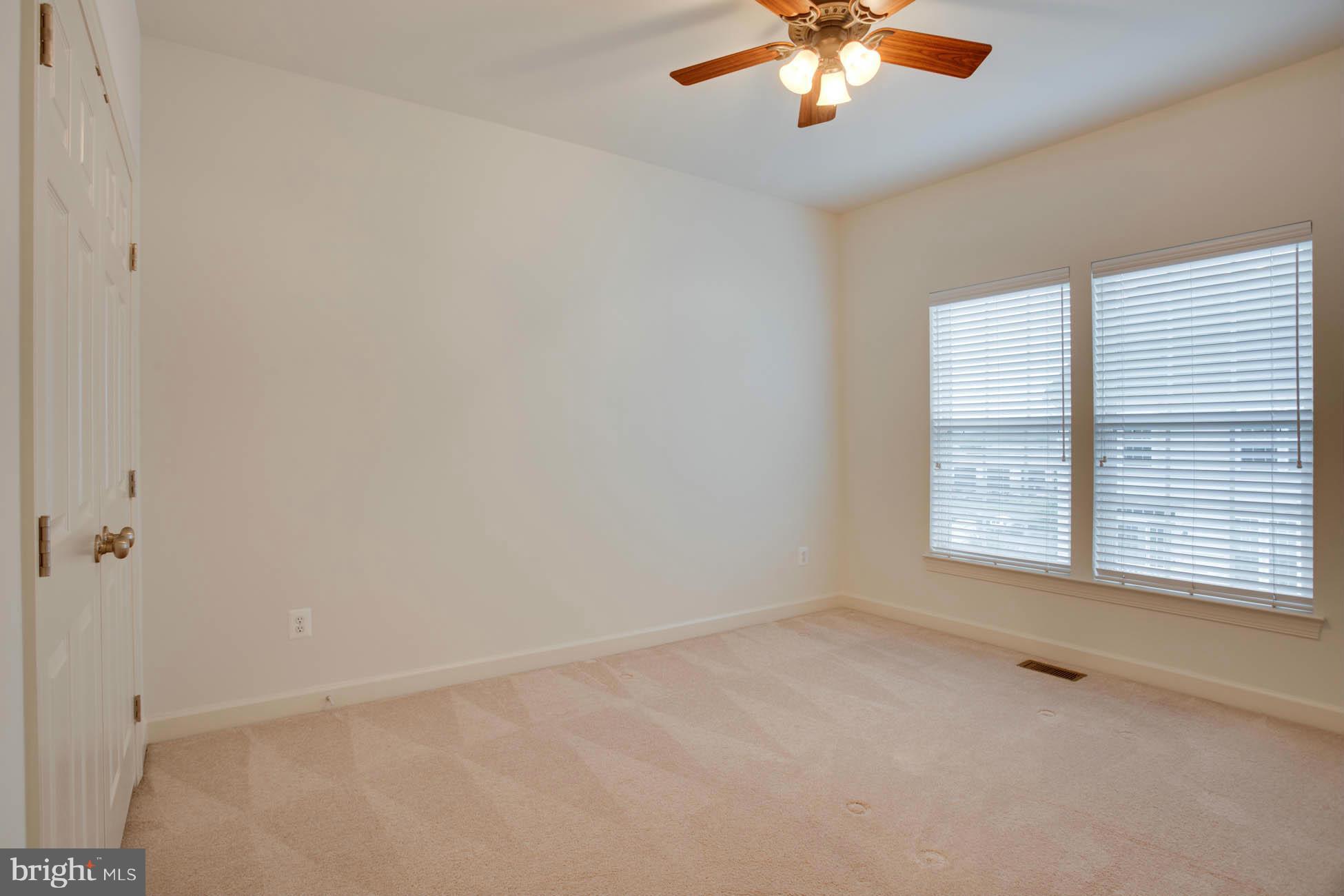 5723 Callcott Way, Unit M Alexandria, VA 22312 - Photo 24 of 28 a view of an empty room with a window
