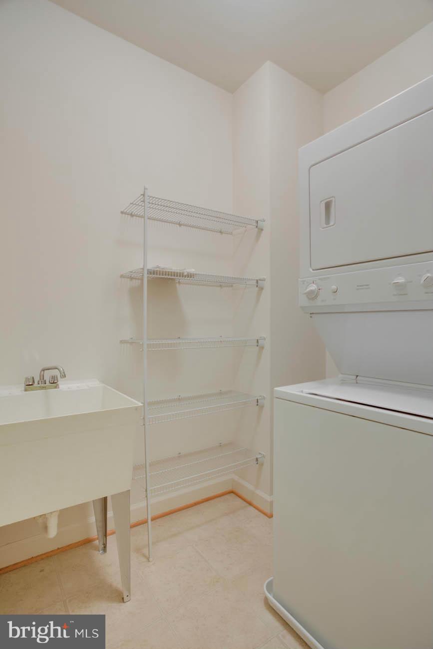5723 Callcott Way, Unit M Alexandria, VA 22312 - Photo 26 of 28 a view of an empty walk in closet