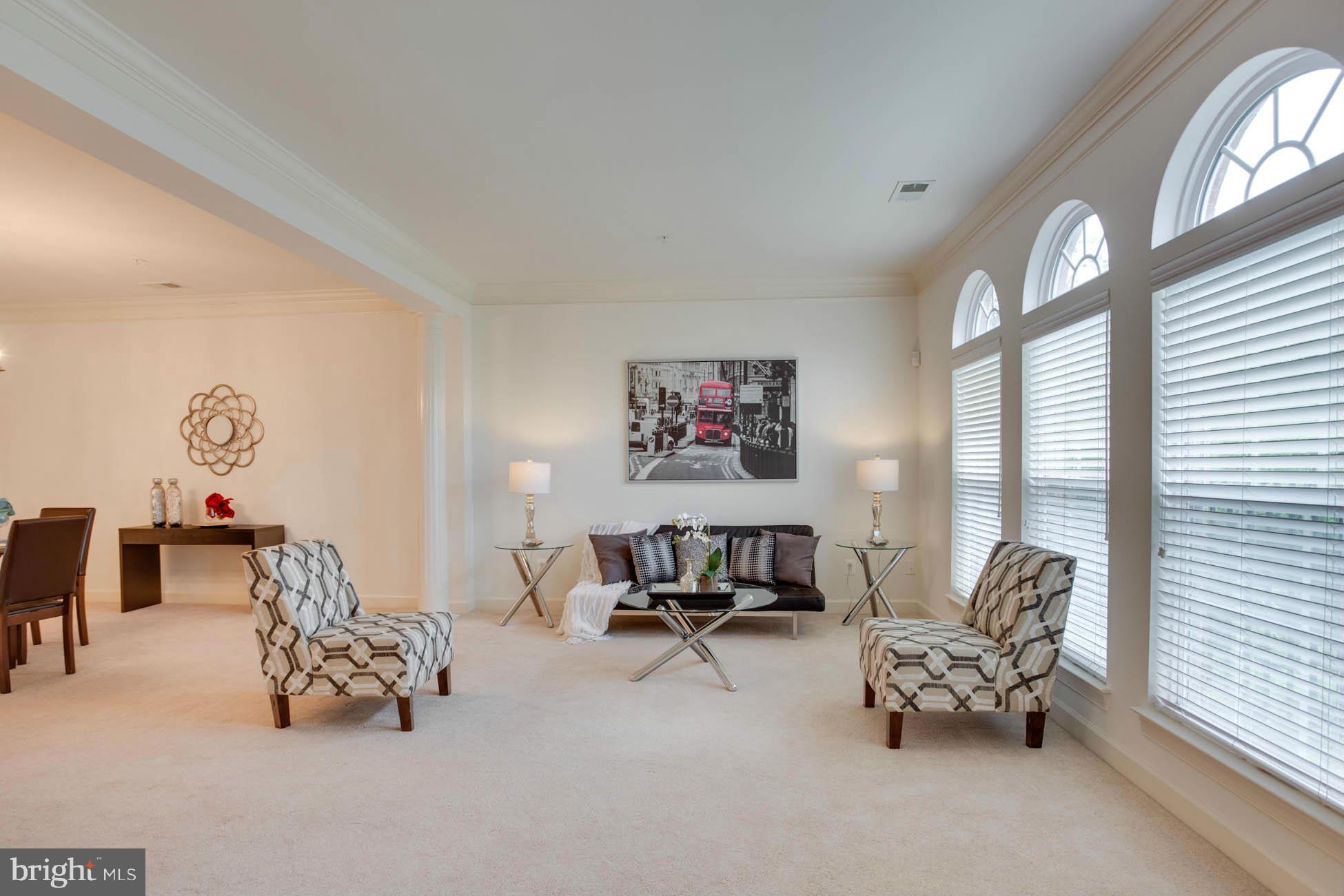 5723 Callcott Way, Unit M Alexandria, VA 22312 - Photo 6 of 28 a living room with furniture and a large window