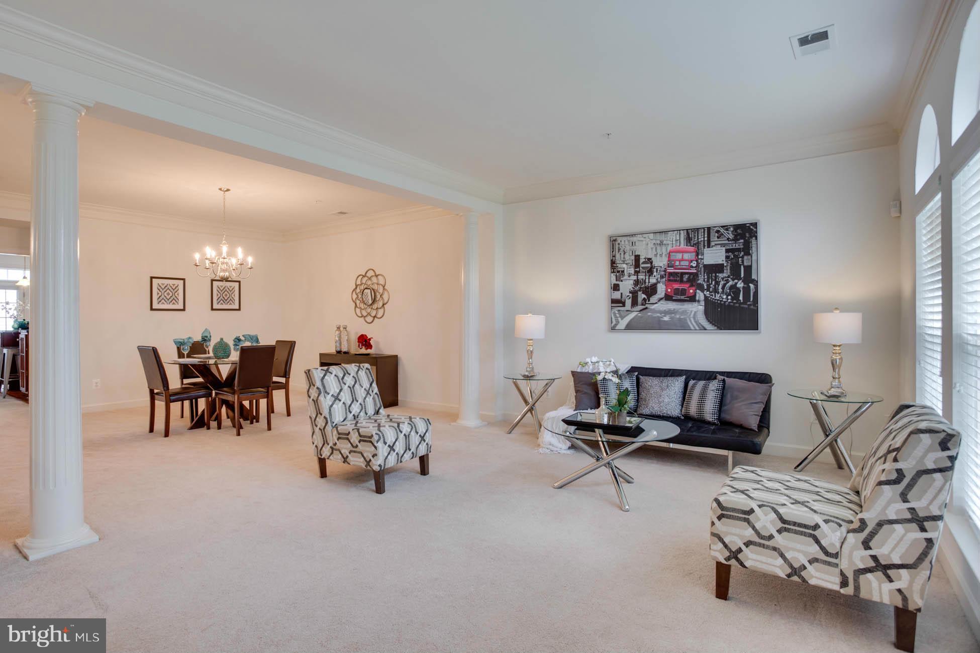 5723 Callcott Way, Unit M Alexandria, VA 22312 - Photo 7 of 28 a living room with furniture and a gym machine