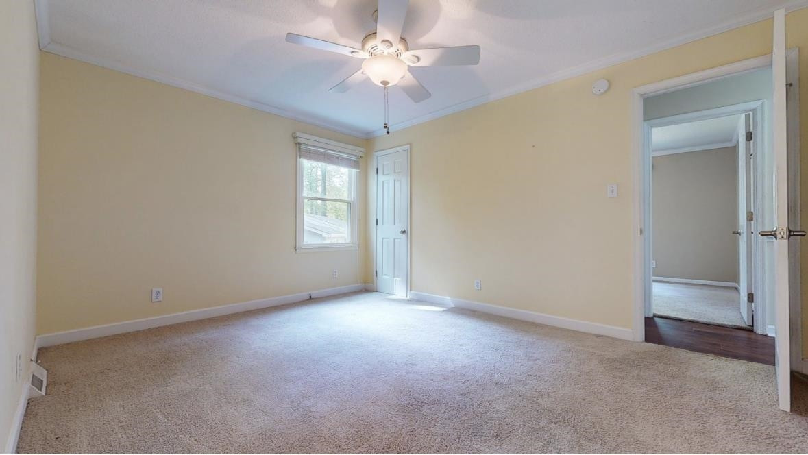 826 Chip Circle Cary, NC 27513 - Photo 21 of 44 a view of an empty room with a window