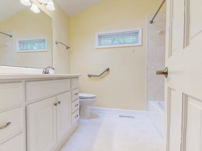 826 Chip Circle Cary, NC 27513 - Photo 22 of 44 a bathroom with a toilet sink and mirror