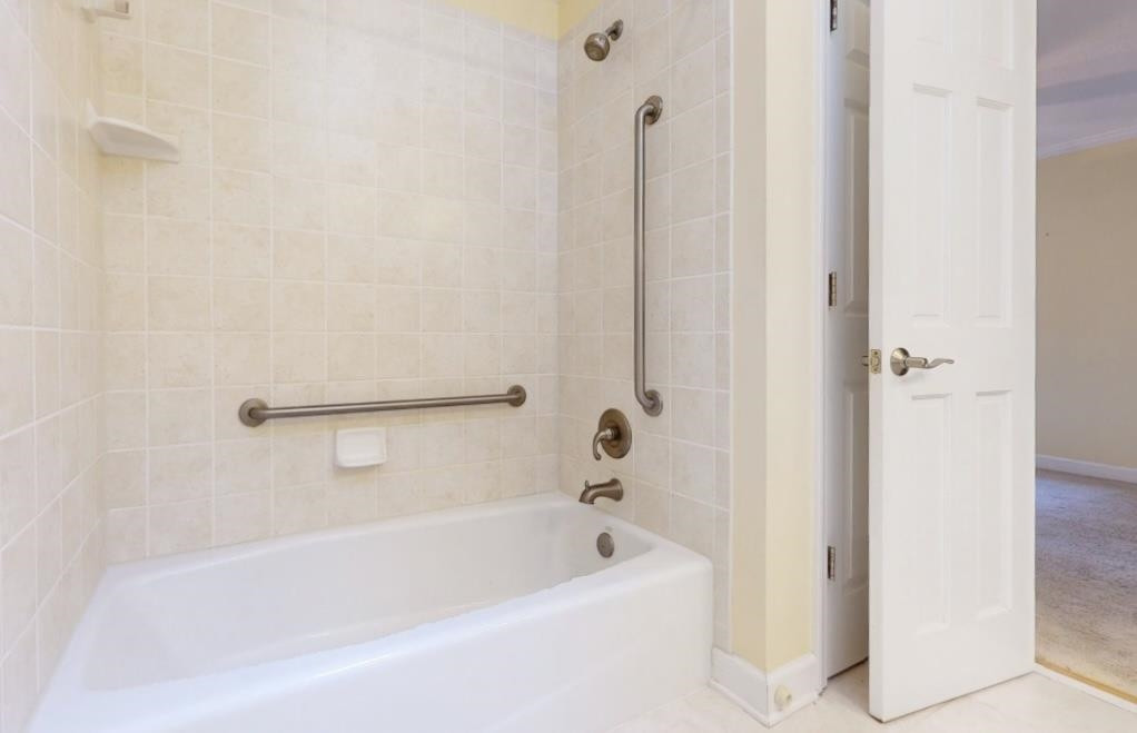 826 Chip Circle Cary, NC 27513 - Photo 24 of 44 a bathroom with a bathtub