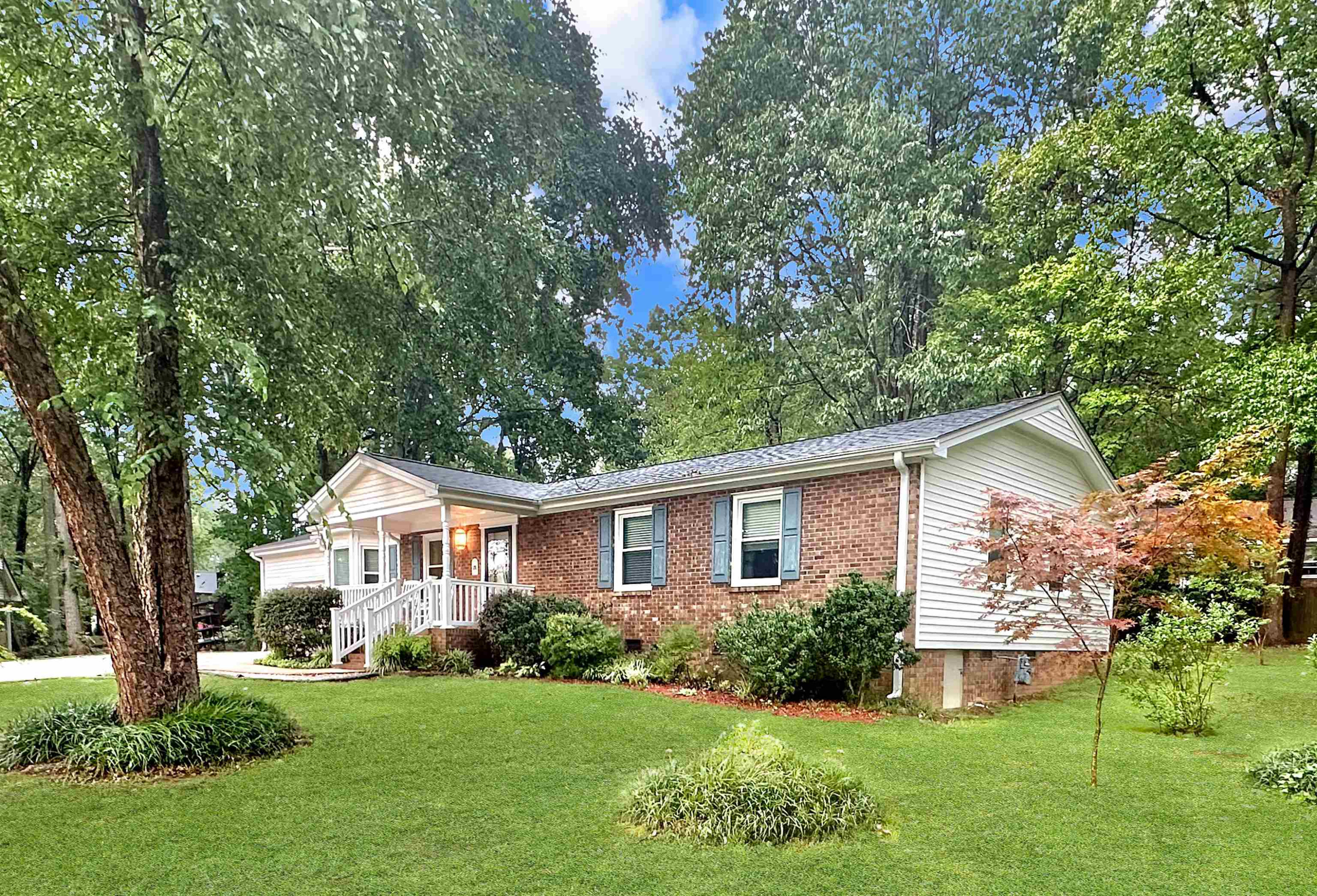 826 Chip Circle Cary, NC 27513 - Photo 3 of 44 a front view of a house with a yard and garage