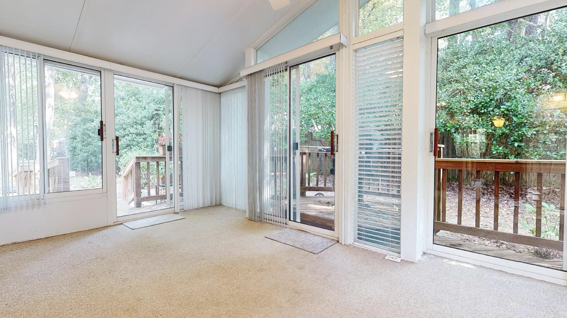 826 Chip Circle Cary, NC 27513 - Photo 32 of 44 a view of a room with balcony and floor to ceiling windows
