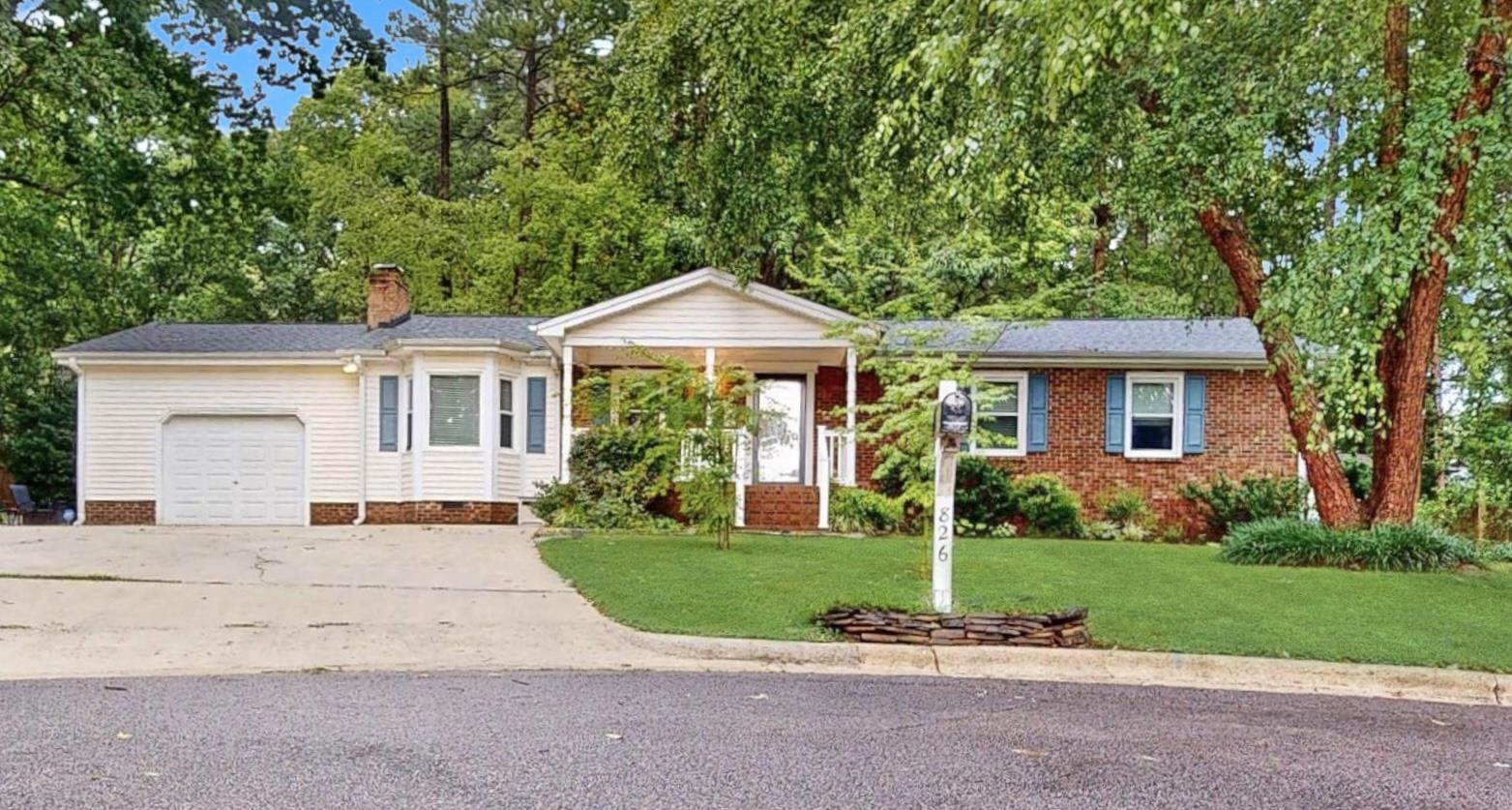 826 Chip Circle Cary, NC 27513 - Photo 5 of 44 a front view of a house with a yard