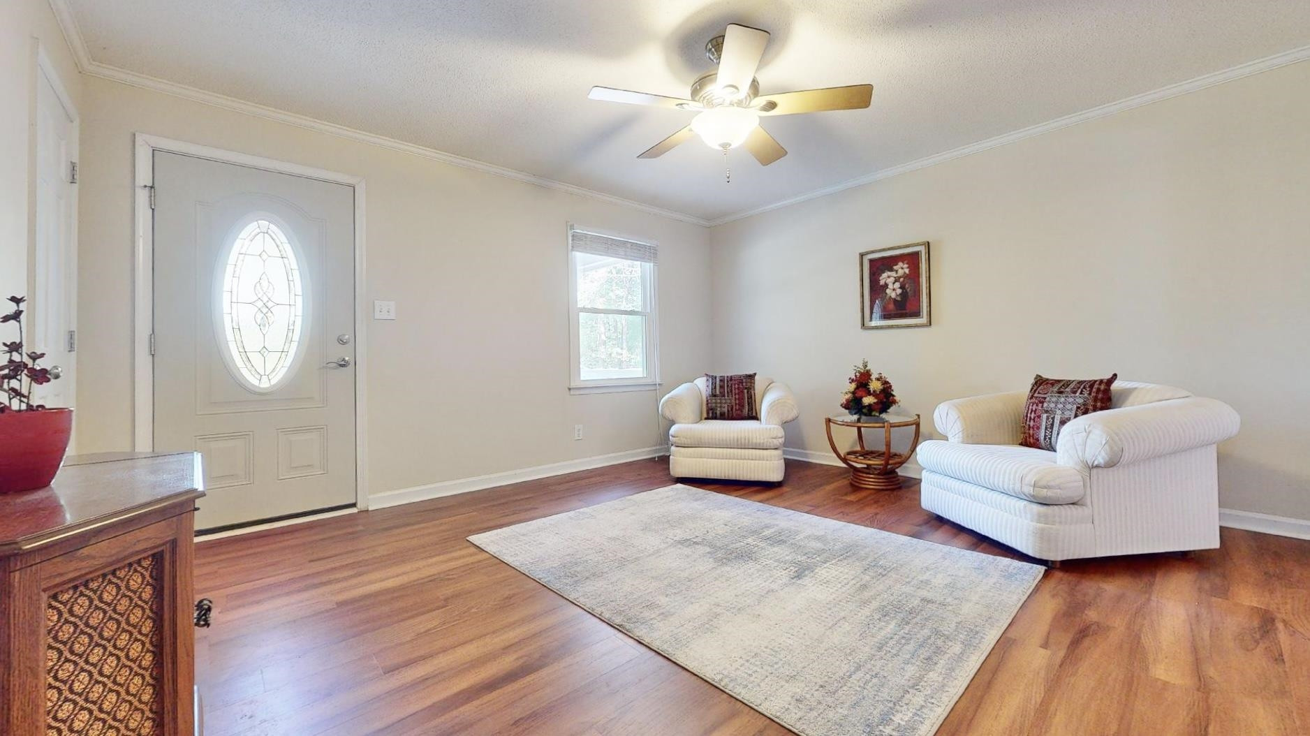 826 Chip Circle Cary, NC 27513 - Photo 7 of 44 a living room with furniture and a chandelier