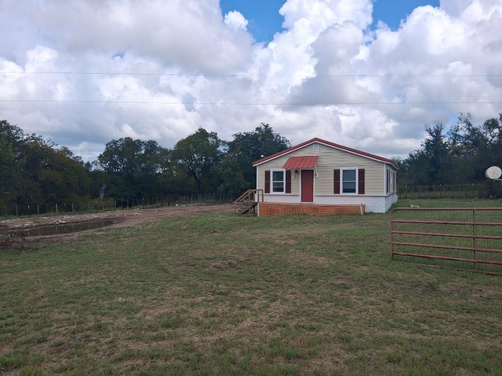 1584 Kelly Road, Unit A Aledo, TX 76008 - Photo 3 of 15 a backyard of a house with lots of green space