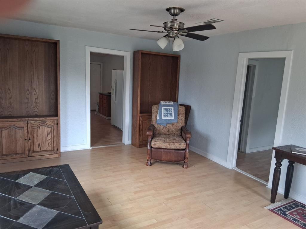 1584 Kelly Road, Unit A Aledo, TX 76008 - Photo 4 of 15 a view of a hallway with wooden floor and workspace
