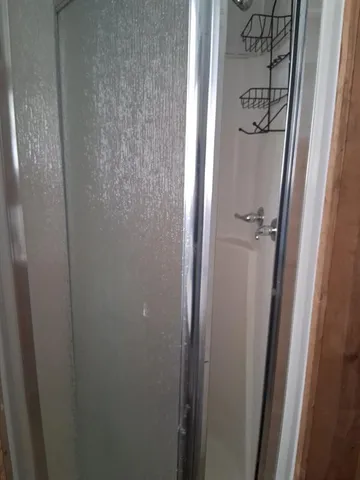a bathroom with a glass door