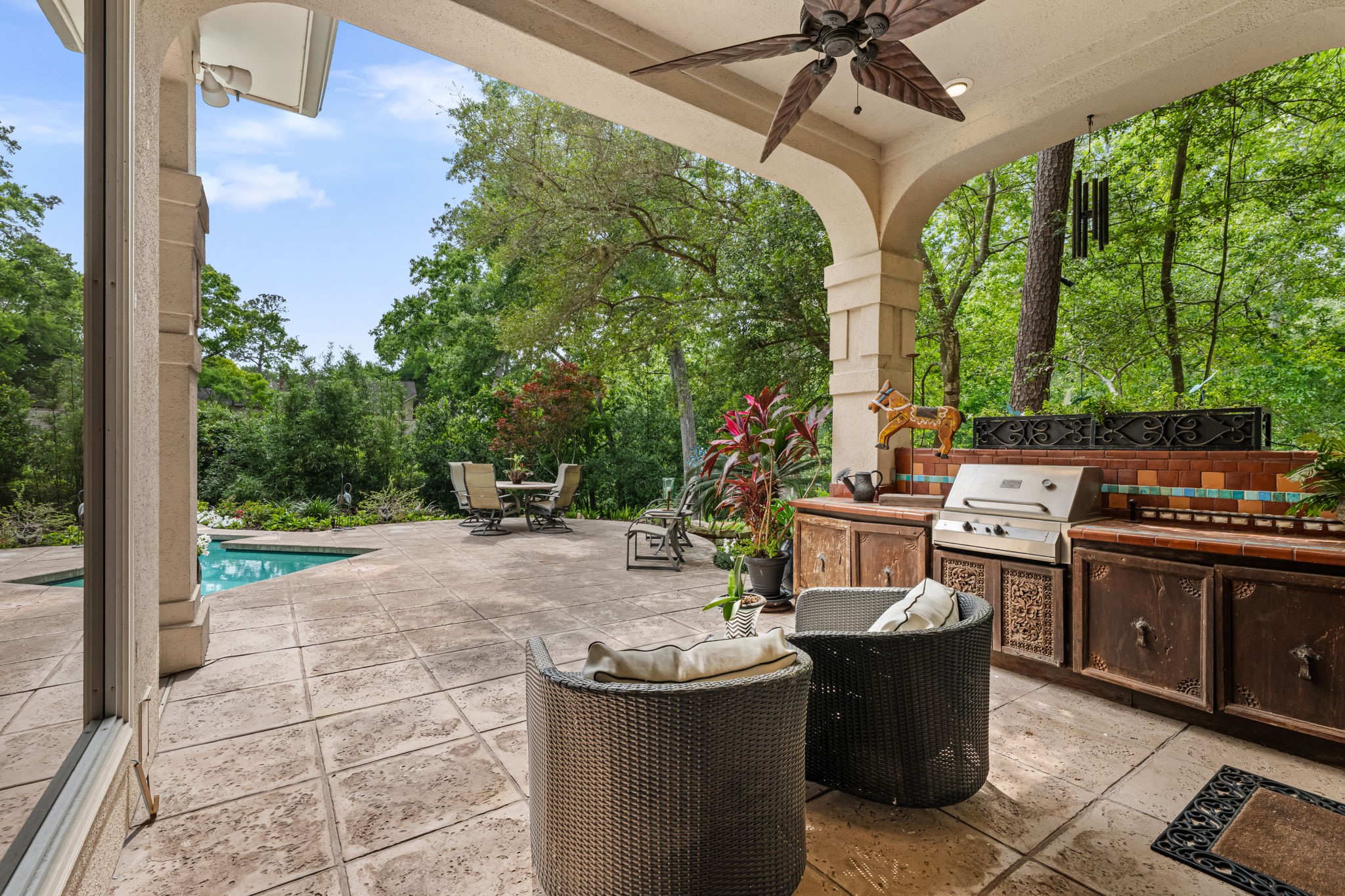 6 Mott Lane Houston, TX 77024 - Photo 43 of 50 Exceptional outdoor living space featuring a covered patio with built-in grill and bar, perfect for year-round entertaining.