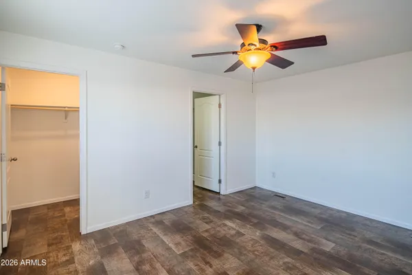 a view of a living room with a ceiling fan