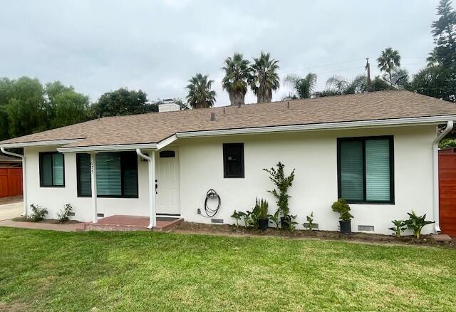 a view of a white house with a outdoor space