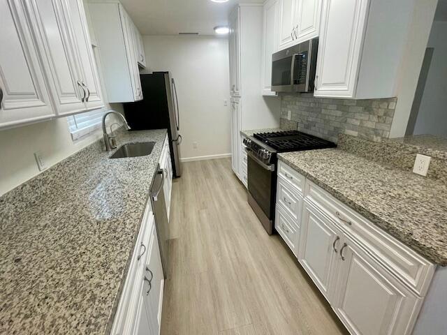 675 Northview Road Santa Barbara, CA 93105 - Photo 2 of 6 a kitchen with a sink stove and microwave