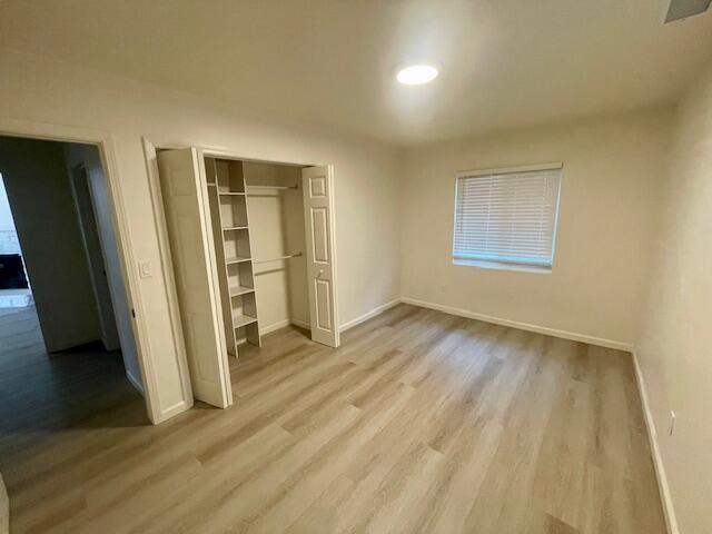 675 Northview Road Santa Barbara, CA 93105 - Photo 3 of 6 an empty room with wooden floor and a window