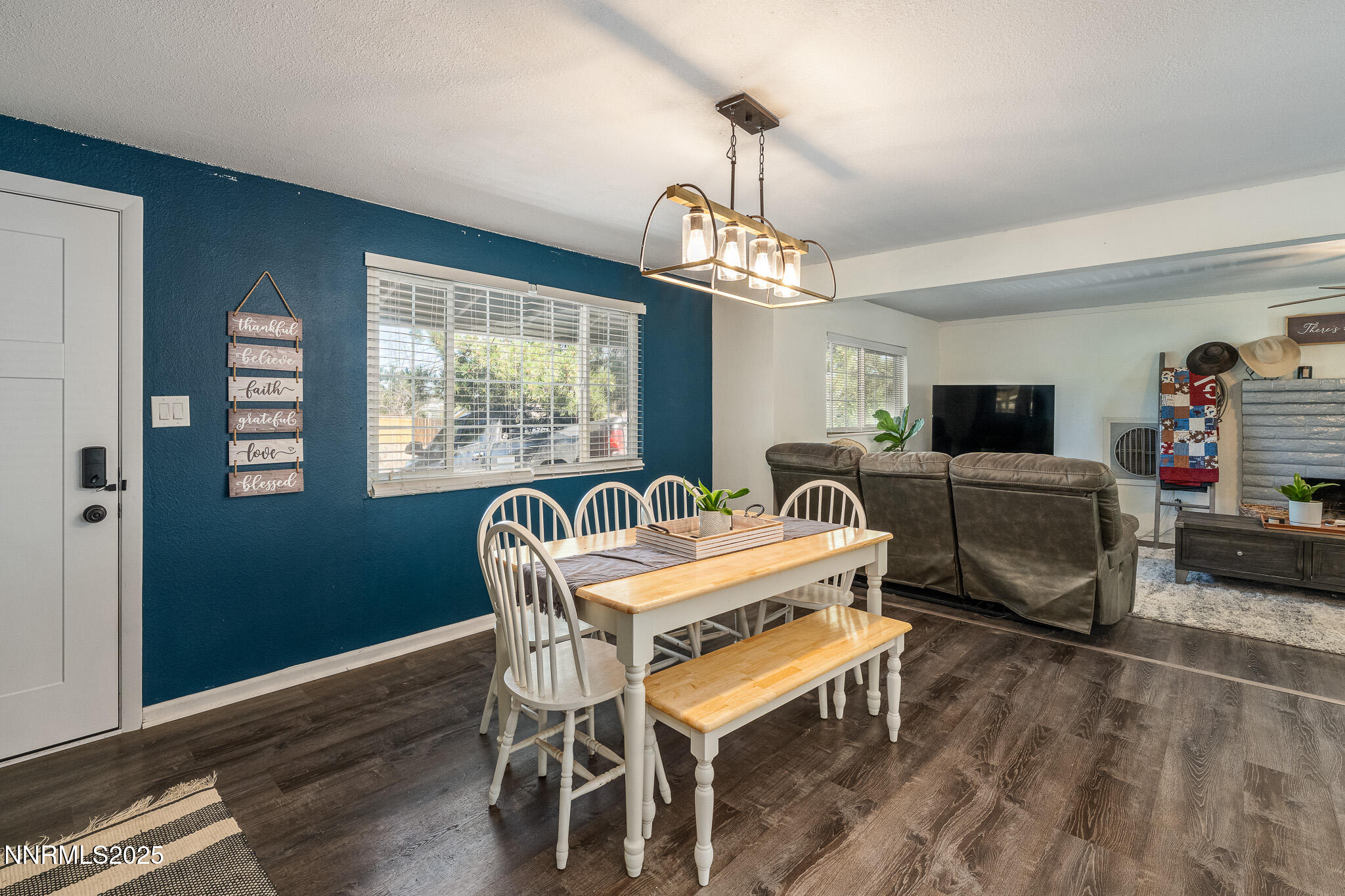 295 Palace Drive Reno, NV 89506 - Photo 3 of 26 a view of a dining room with furniture window and wooden floor