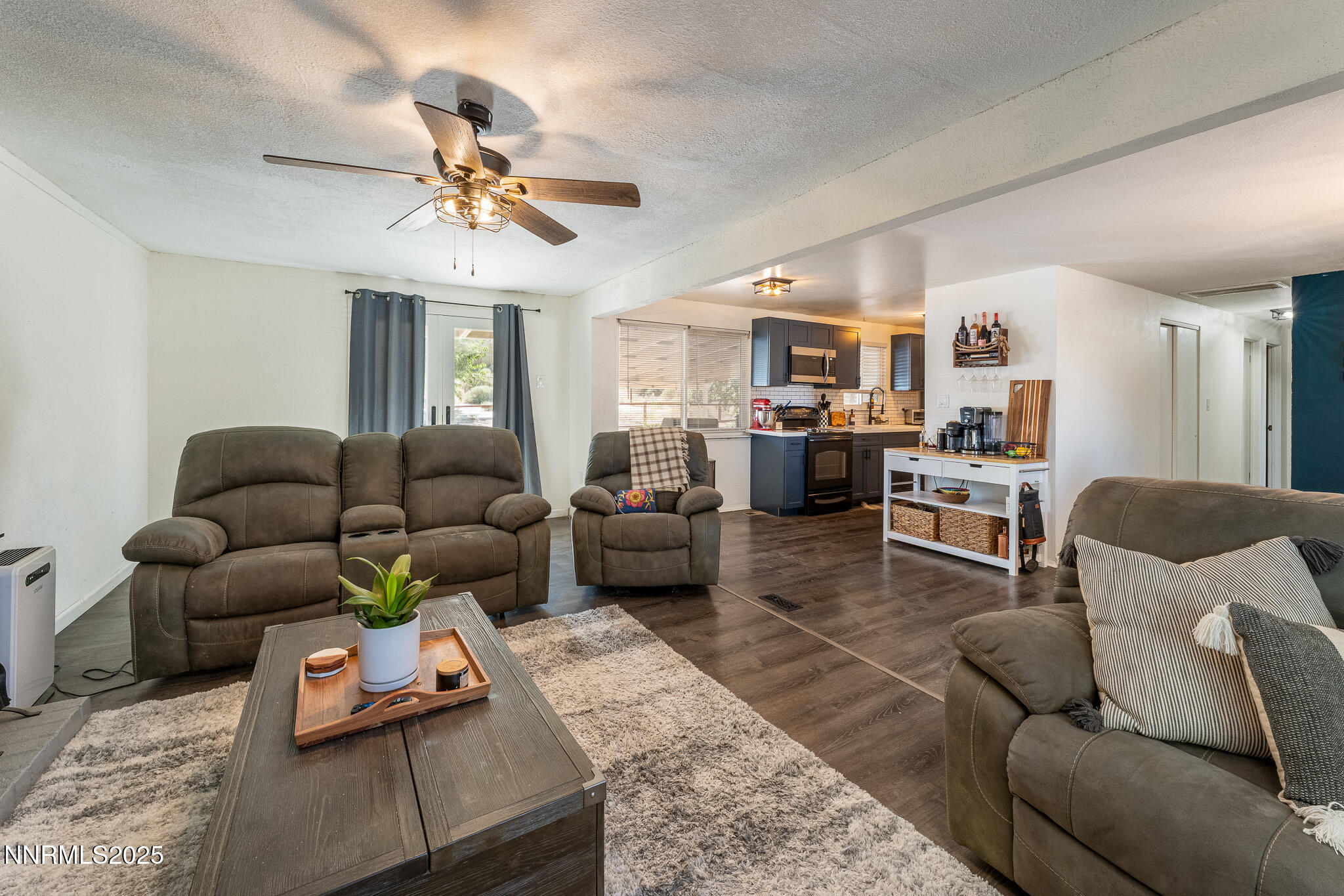 295 Palace Drive Reno, NV 89506 - Photo 5 of 26 a living room with furniture kitchen view and a chandelier