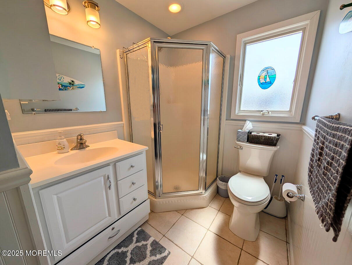 31 East Cormorant Way Lavallette, NJ 08735 - Photo 14 of 22 a bathroom with a granite countertop sink toilet a mirror and shower