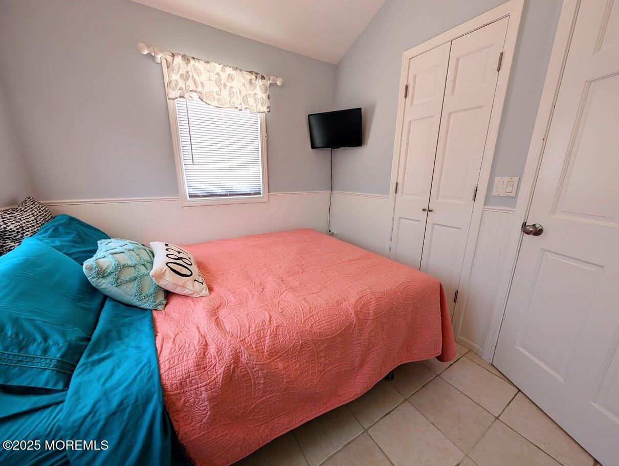 31 East Cormorant Way Lavallette, NJ 08735 - Photo 18 of 22 a bed sitting in a bedroom next to a window