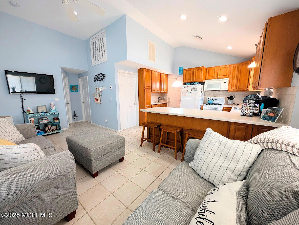 31 East Cormorant Way Lavallette, NJ 08735 - Photo 4 of 22 a living room with furniture and a flat screen tv