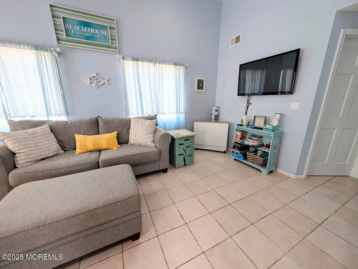 31 East Cormorant Way Lavallette, NJ 08735 - Photo 7 of 22 a living room with furniture and a flat screen tv