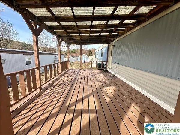a view of outdoor space with wooden floor