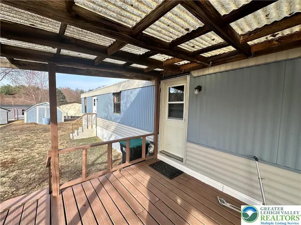 a view of a balcony with wooden floor