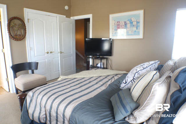26050 Marina Road, Unit 8 Orange Beach, AL 36561 - Photo 28 of 38 Each bedroom has their own closet as well as private balcony. The window to the right provides canal views!