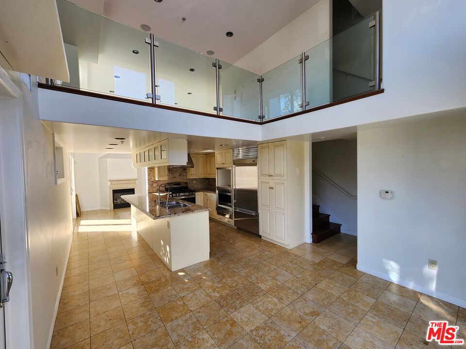 Almayo Avenue Los Angeles, CA 90064 - Photo 11 of 35 a view of a kitchen with furniture and a kitchen