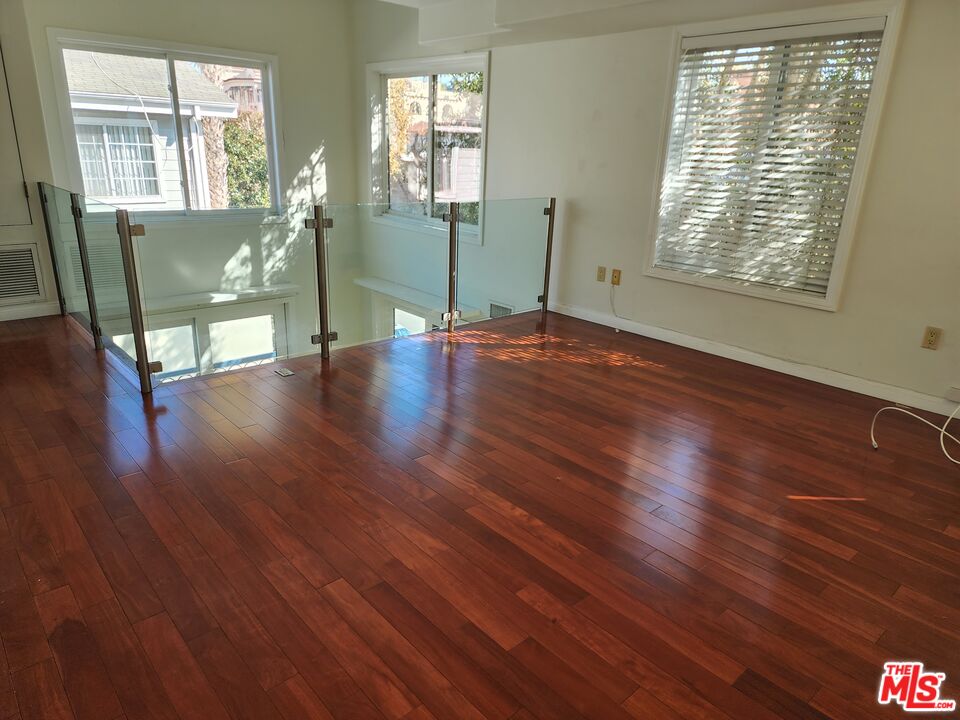 Almayo Avenue Los Angeles, CA 90064 - Photo 13 of 35 a view of an empty room with wooden floor and a window