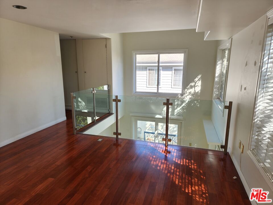 Almayo Avenue Los Angeles, CA 90064 - Photo 14 of 35 a view of a room with wooden floor and staircase