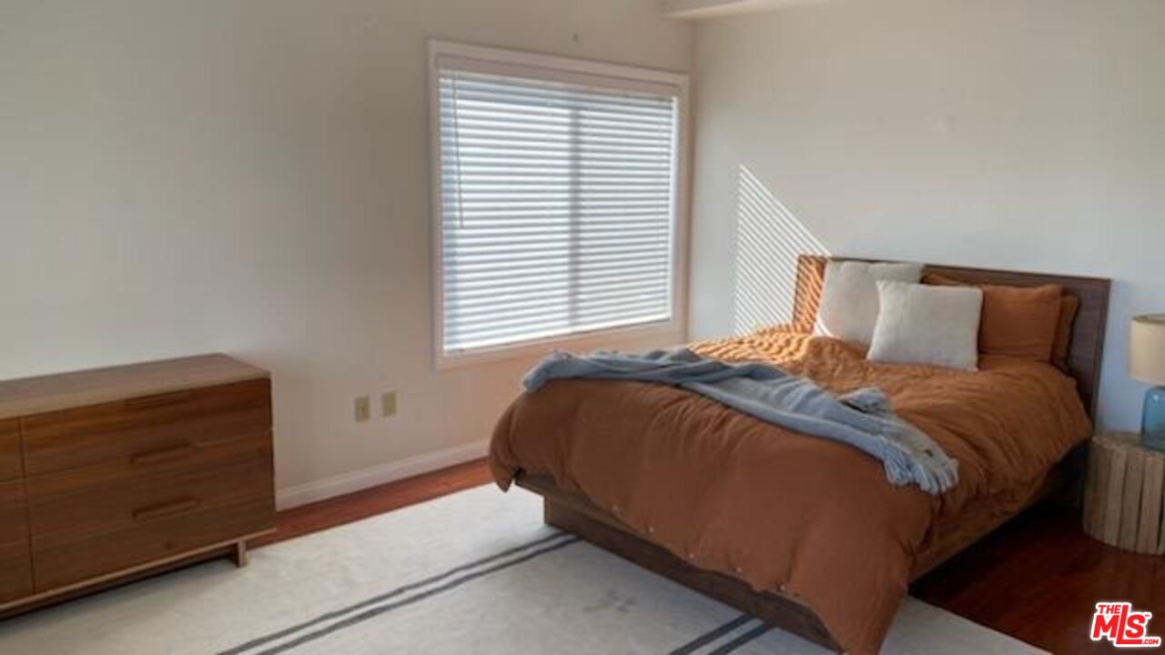 Almayo Avenue Los Angeles, CA 90064 - Photo 17 of 35 a bedroom with a bed and a window