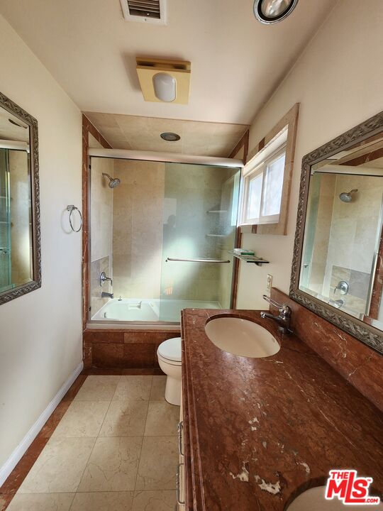Almayo Avenue Los Angeles, CA 90064 - Photo 20 of 35 a bathroom with a sink a toilet and shower