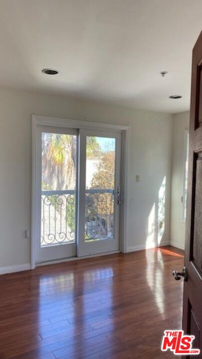 Almayo Avenue Los Angeles, CA 90064 - Photo 23 of 35 a view of an empty room with wooden floor and a window