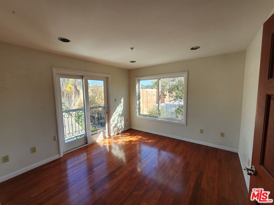 Almayo Avenue Los Angeles, CA 90064 - Photo 24 of 35 a view of an empty room with wooden floor and a window