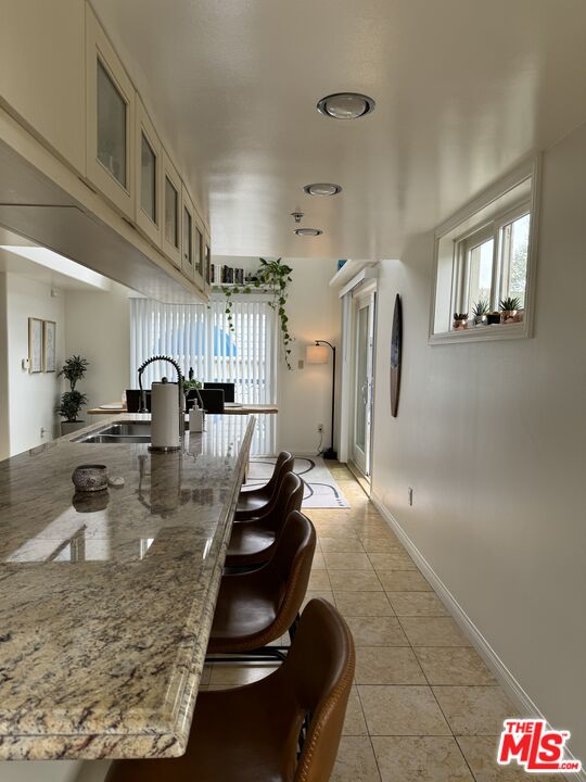 Almayo Avenue Los Angeles, CA 90064 - Photo 33 of 35 a kitchen with refrigerator and natural light