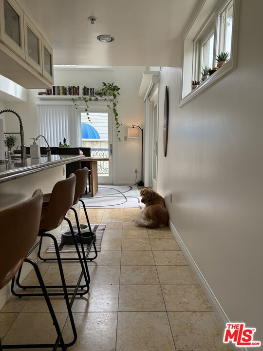 Almayo Avenue Los Angeles, CA 90064 - Photo 7 of 35 a living room with furniture a rug and white walls