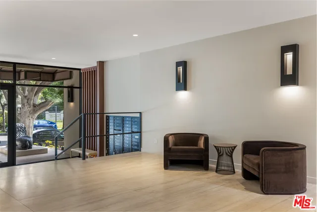 a room with furniture and a floor to ceiling window