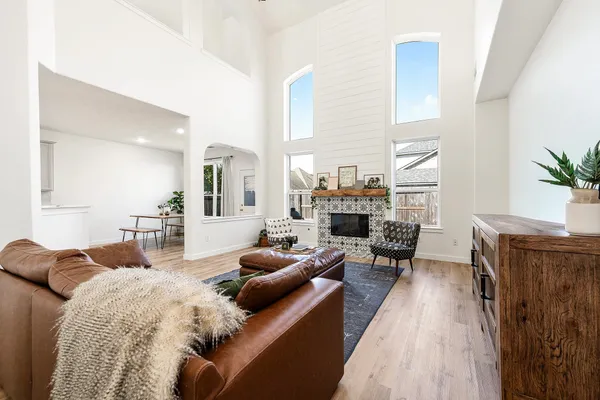 a living room with furniture and a fireplace