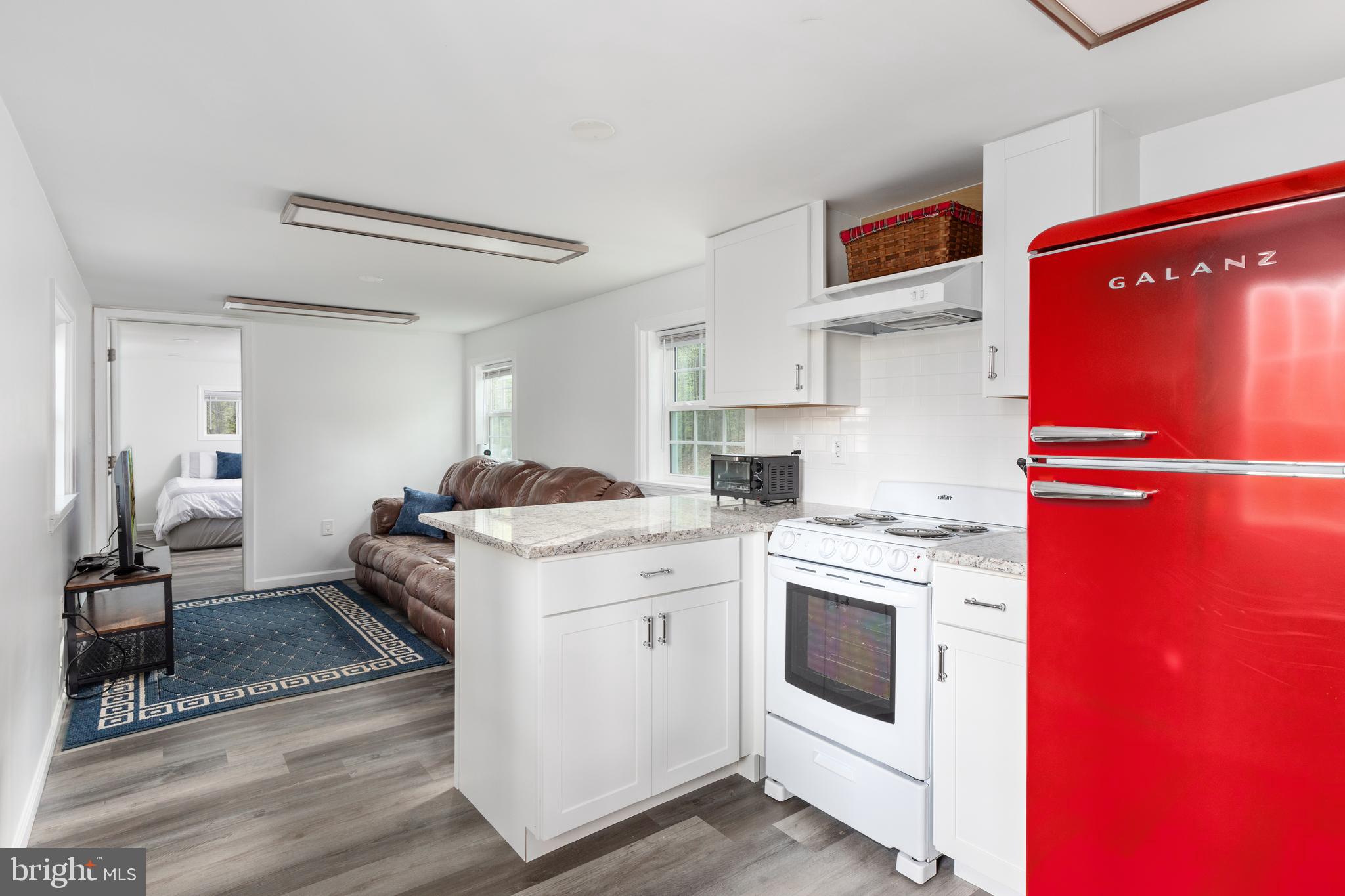 4518 Highpoint Lane The Plains, VA 20198 - Photo 2 of 4 a kitchen with white cabinets and appliances