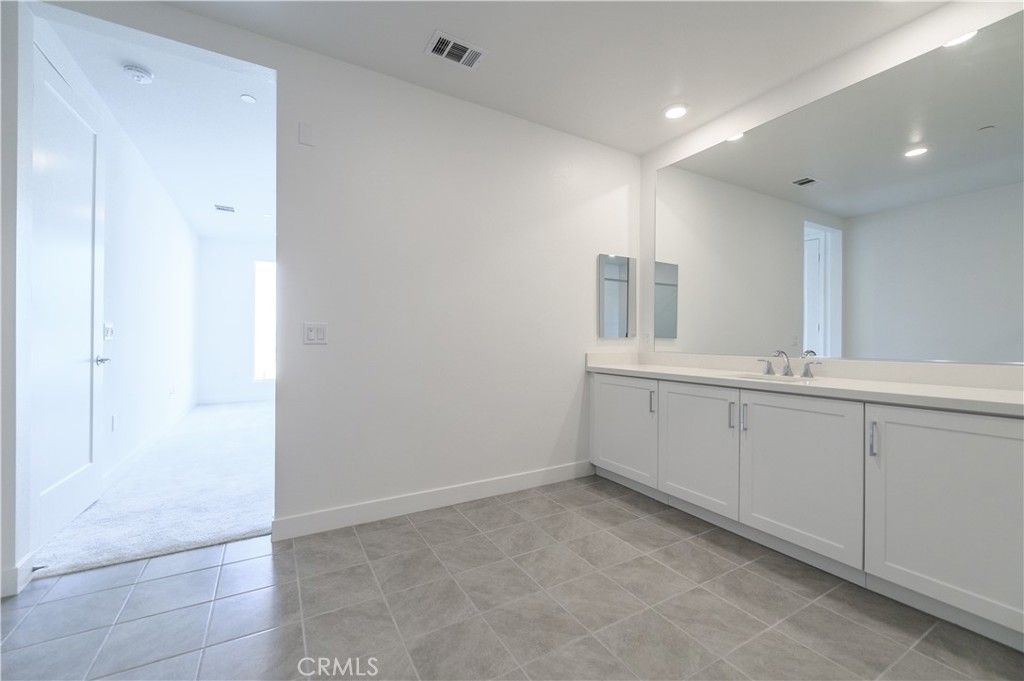 3608 Rivington Irvine, CA 92612 - Photo 35 of 74 a bathroom with a sink and a mirror