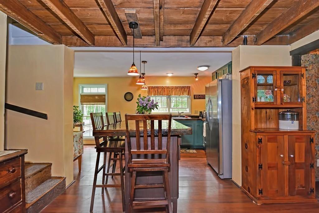 81 Warren Road Brimfield, MA 01010 - Photo 8 of 42 a view of a dining room with furniture window and wooden floor