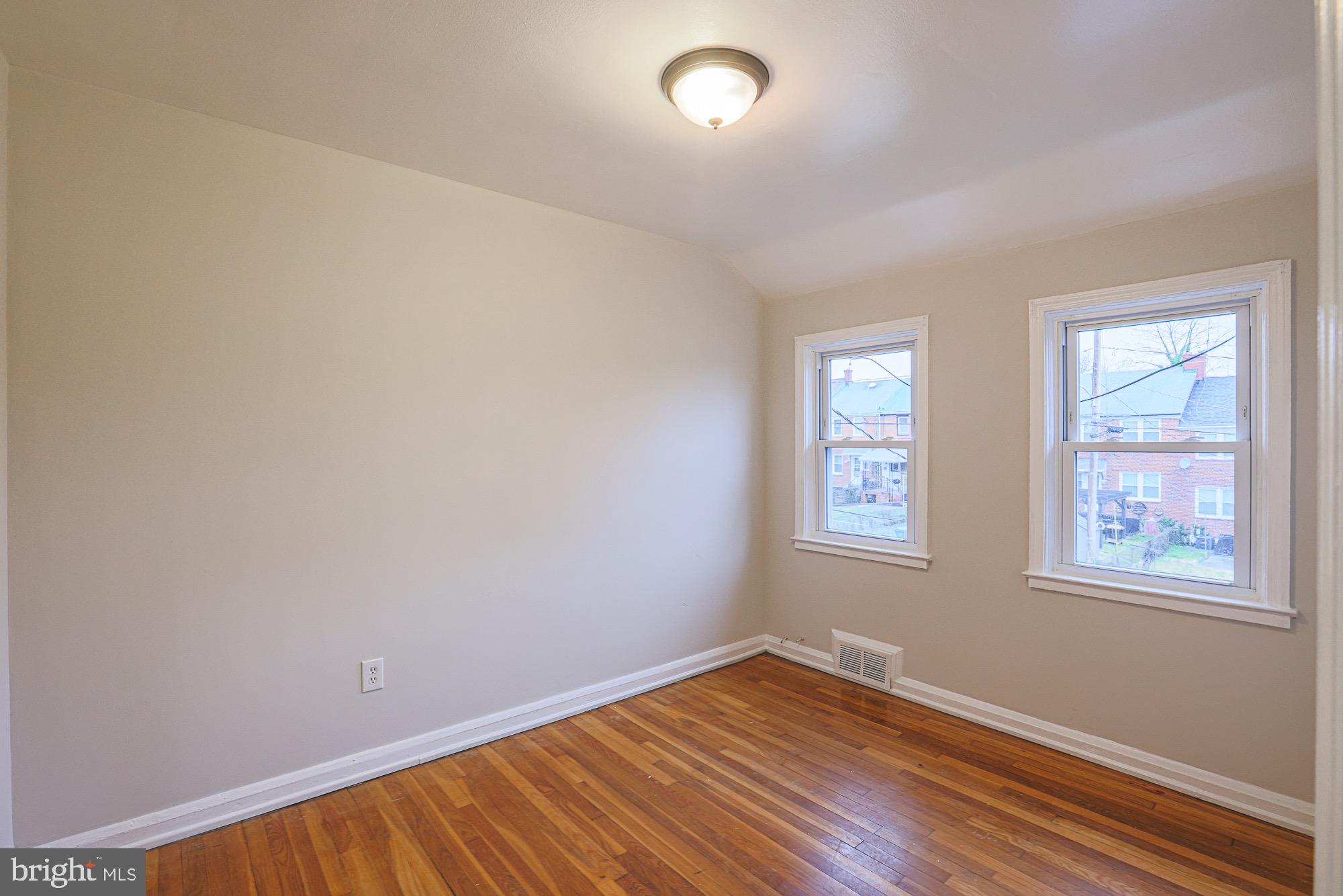 1022 Cameron Road Baltimore, MD 21212 - Photo 11 of 21 an empty room with windows
