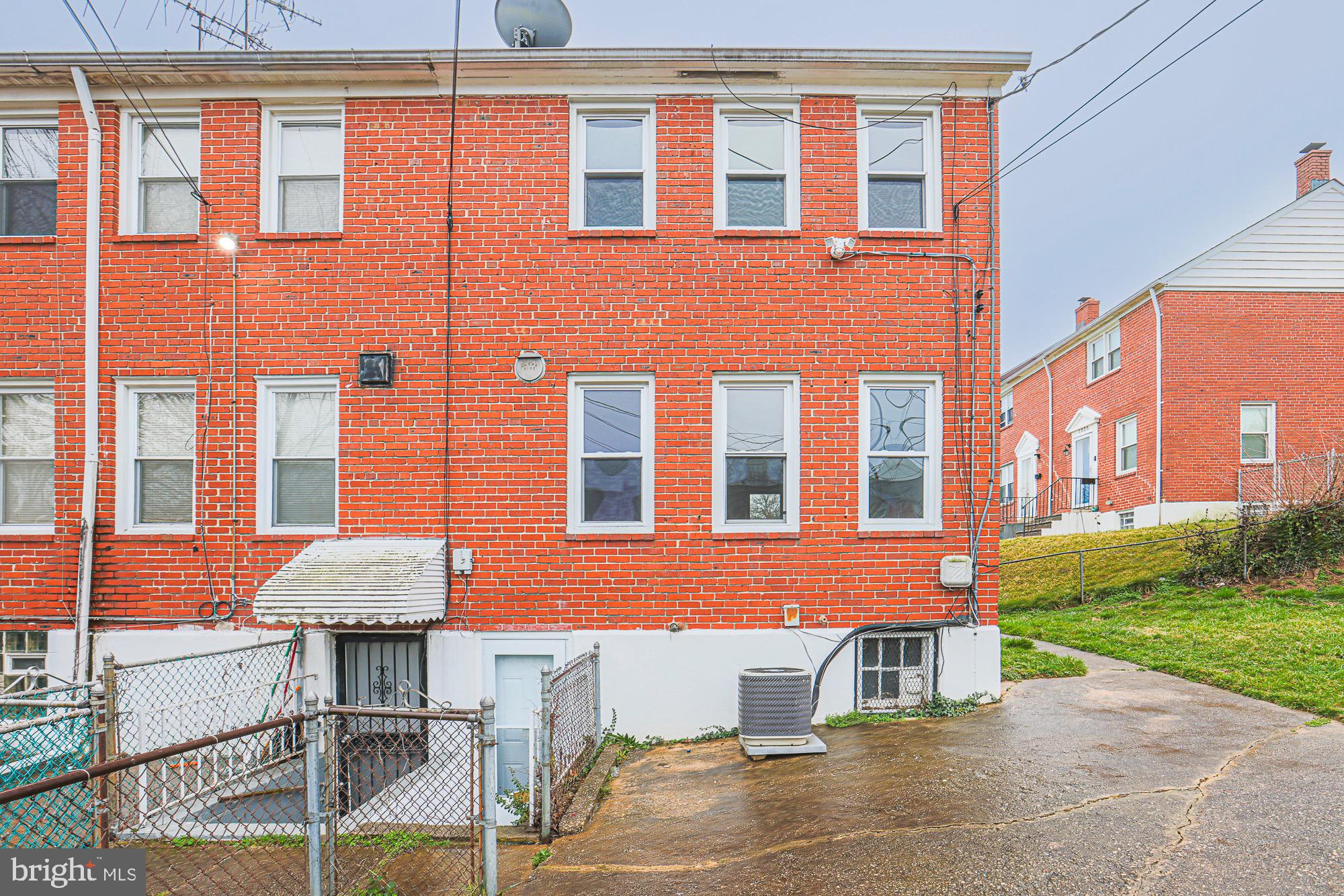 1022 Cameron Road Baltimore, MD 21212 - Photo 20 of 21 a front view of a building with a garden and plants